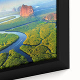 Close-up of a framed canvas wall art piece featuring a vibrant rainforest landscape design, showcasing lush green foliage and colorful tropical plants, perfect for enhancing home decor.