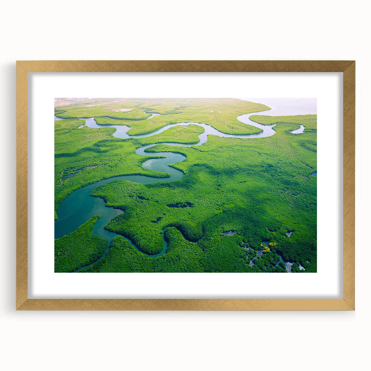 Framed rainforest landscape wall art design with a gold mat and frame, showcasing vibrant greenery and tropical elements, perfect for nature-inspired decor.