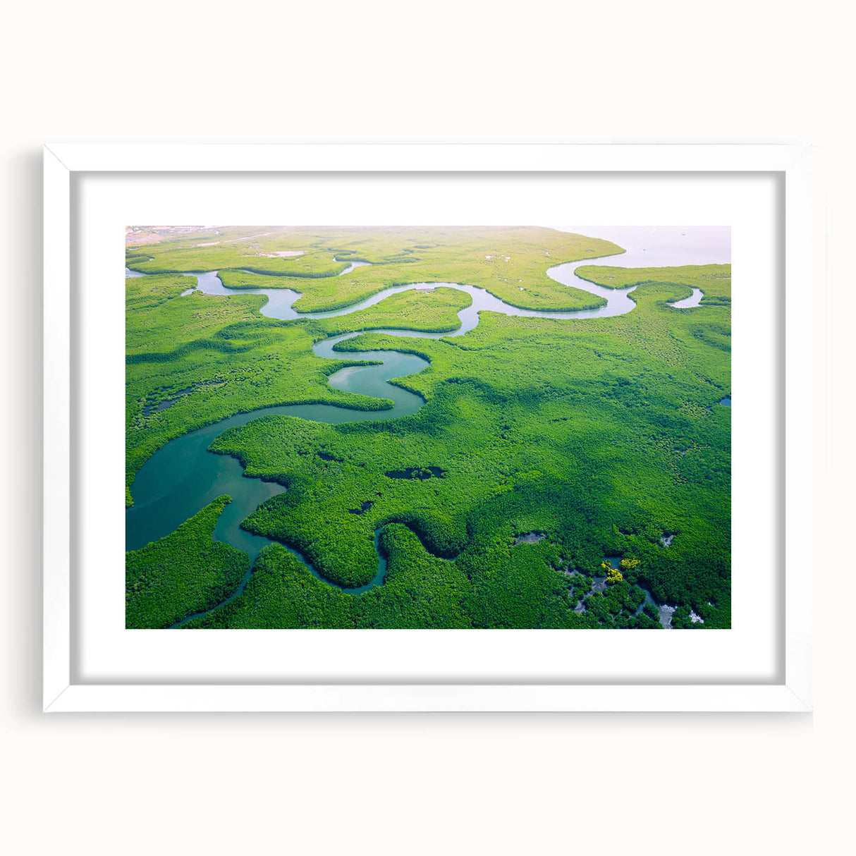Framed rainforest landscape wall art design showcasing vibrant greens and earthy tones, set in a sleek white frame with a mat, ideal for home decor.