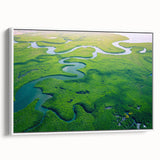 Framed canvas artwork depicting a vibrant rainforest landscape, showcasing lush greenery and a serene atmosphere, ideal for enhancing home decor.
