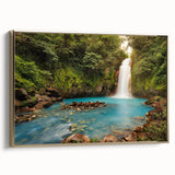 Framed canvas artwork showcasing a vibrant rainforest landscape design, featuring lush green foliage and colorful flora, accented by a gold frame. Perfect for nature-themed decor.
