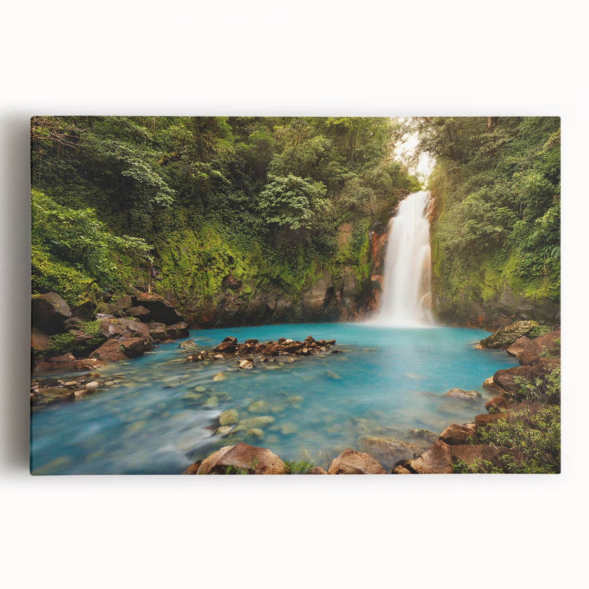 Vibrant rainforest landscape wall art on stretched canvas, showcasing lush greenery and vivid colors, perfect for adding a tropical touch to home decor.