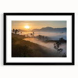 Framed rainforest landscape wall art in a sleek black frame with a white mat, showcasing vibrant greenery and natural elements, perfect for home decor.