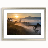 Framed wall art showcasing a vibrant rainforest landscape design, featuring lush greens and intricate details, with a sleek silver frame and matting for an elegant display.