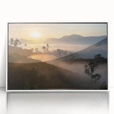 Framed acrylic wall art showcasing a vibrant rainforest landscape in vivid greens and blues, elegantly displayed with a white frame, perfect for home decor.