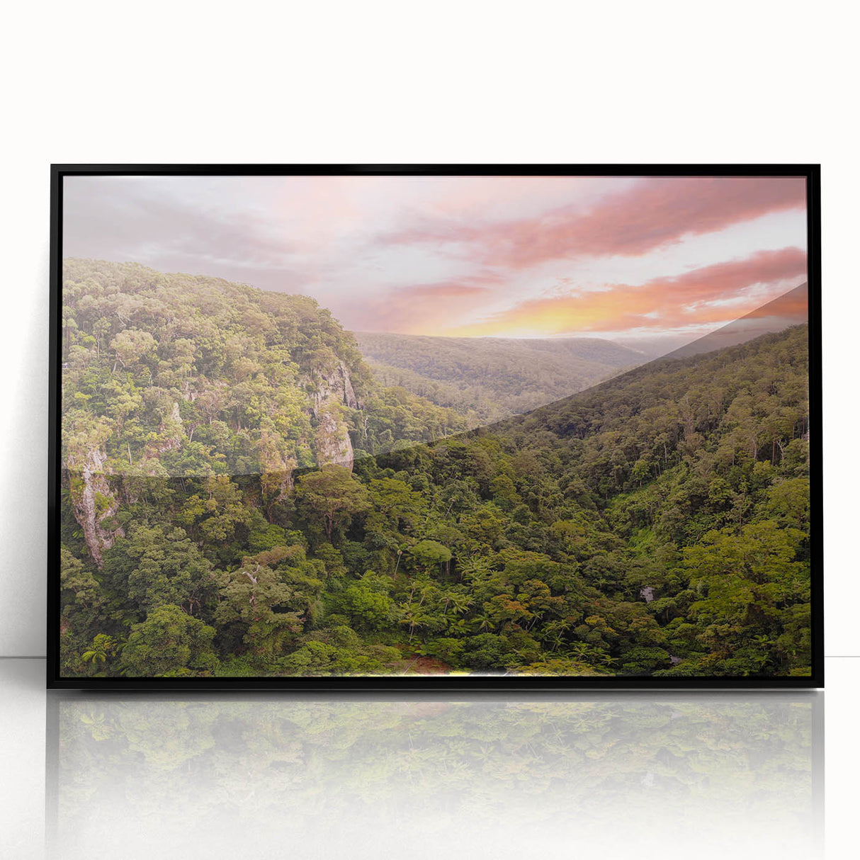 Framed acrylic wall art showcasing a vibrant rainforest landscape design with lush green foliage and tropical elements, perfect for home decor enhancement.