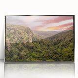 Framed acrylic wall art showcasing a vibrant rainforest landscape design, featuring lush greenery and rich colors, displayed in a sleek silver frame for modern decor.