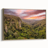 Framed canvas art featuring a vibrant rainforest landscape design with gold accents, showcasing lush greenery and tropical elements, perfect for home decor.
