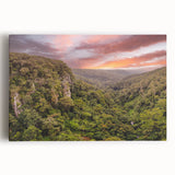 Vibrant stretched canvas artwork depicting a lush rainforest landscape, showcasing rich greens and earthy tones, perfect for enhancing home decor with nature-inspired design.