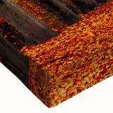 Close-up of a stretched canvas wall art piece showcasing a vibrant landscape design featuring winding roads and lush greenery, perfect for home or office decor.