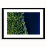 Framed wall art featuring a serene landscape design, showcasing a winding road bordered by lush greenery, with a sleek black frame and mat, ideal for home decor.