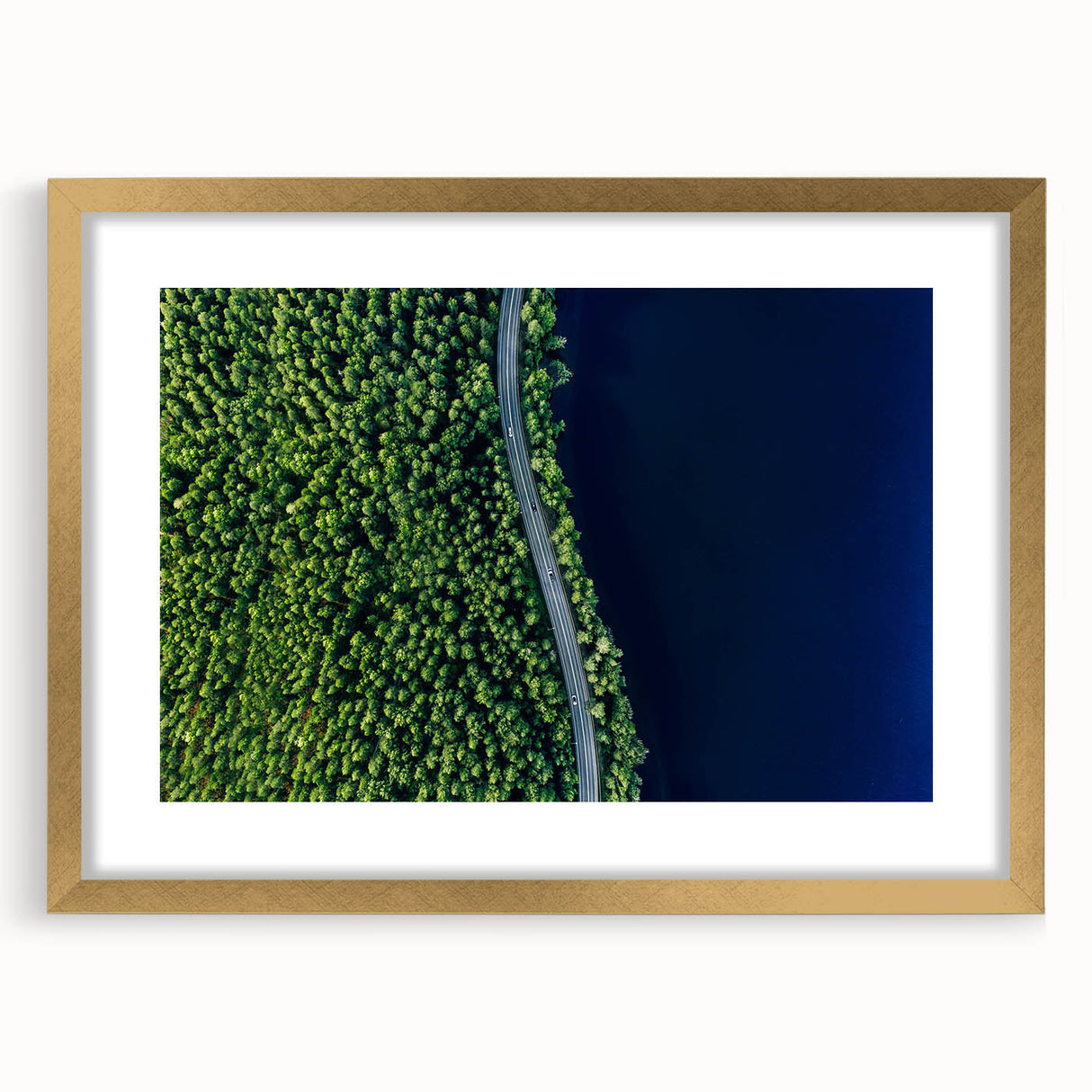 Framed wall art featuring a stunning landscape road design with a gold mat, perfect for enhancing home decor and adding a touch of elegance to any room.