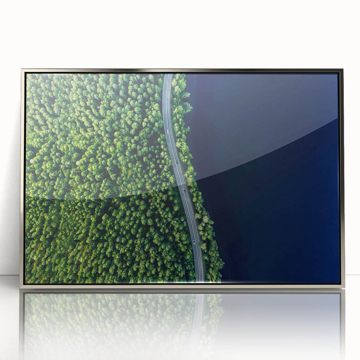 Framed acrylic wall art from the Landscapes Roads Design collection, showcasing a serene road scene with silver accents, perfect for modern home decor.