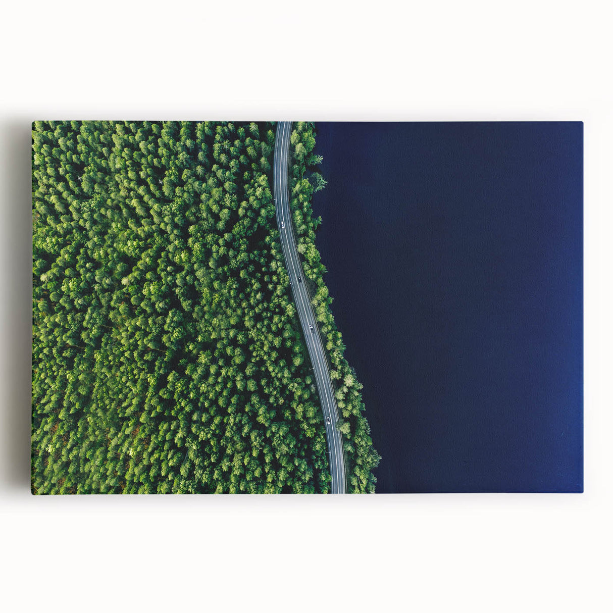 Stretched canvas wall art featuring a scenic landscape of winding roads, vibrant greenery, and a serene sky, perfect for home decor and interior design enthusiasts.