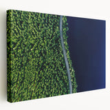 Stretched canvas wall art showcasing a scenic landscape with winding roads, vibrant greens, and blue skies, perfect for home decor enhancement.