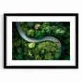 Framed wall art of a scenic landscape featuring winding roads, surrounded by a stylish black mat, ideal for enhancing modern home decor.