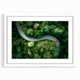 Framed wall art showcasing a serene landscape road design, featuring a white mat and sleek frame, perfect for enhancing modern home decor aesthetics.
