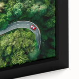 Framed canvas wall art showcasing a close-up of a vibrant landscape design featuring winding roads, rich colors, and intricate details, perfect for home decor.