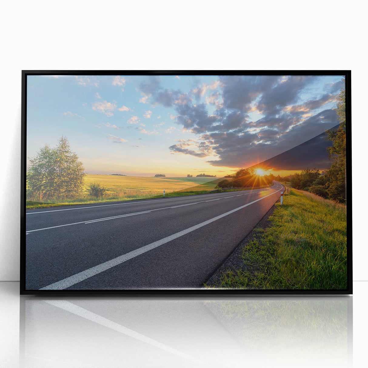 Framed wall art featuring a modern landscape design with winding roads and vibrant colors, housed in a sleek black frame, perfect for enhancing contemporary interiors.