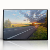 Framed wall art featuring a modern landscape design with winding roads and vibrant colors, housed in a sleek black frame, perfect for enhancing contemporary interiors.