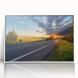 Framed acrylic wall art featuring a scenic landscape with winding roads, presented in a sleek white frame, perfect for modern home decor.