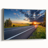 Framed canvas wall art showcasing a serene landscape with winding roads, set against a silver frame, perfect for modern home decor and aesthetic enhancement.