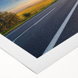 Abstract landscape wall art featuring winding roads and vibrant colors, printed on rolled canvas, ideal for modern home decor or artistic displays.