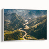 Framed canvas wall art featuring a serene landscape with winding roads, showcasing vibrant colors and intricate details, ideal for home decor in modern settings.