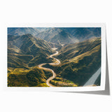 Rolled print showcasing a vibrant landscape road design in rich colors, ideal for home decor, packaged securely in a protective cardboard tube for delivery.