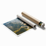 Rolled print of a vibrant landscape design featuring winding roads, rich colors, and intricate details, perfect for home decor or art collection.