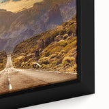 Close-up of a framed canvas wall art piece depicting a serene landscape with winding roads and vibrant colors. Ideal for home decor, this artwork adds a calming touch.