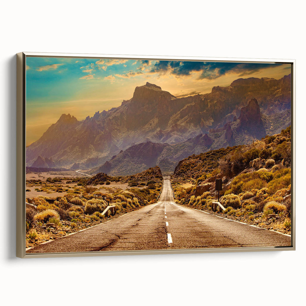 Framed canvas wall art showcasing a serene landscape with winding roads and lush greenery, accented by a luxurious gold frame, perfect for home decor.