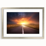 Framed wall art collection showcasing a scenic landscape with winding roads, presented in a sleek silver frame with a white mat, perfect for enhancing home decor.