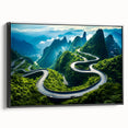 Framed canvas wall art showcasing a scenic landscape with winding roads and lush greenery, displayed in black frame for a modern aesthetic.