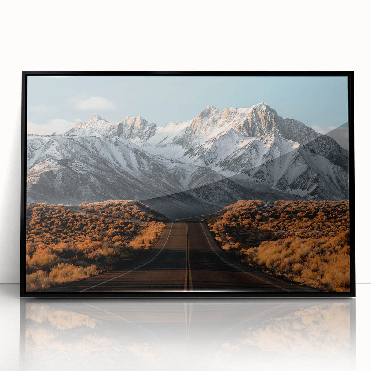 Framed acrylic wall art featuring a scenic landscape of winding roads, presented in a sleek black frame, adding a modern touch to home decor.
