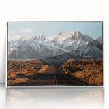 Framed acrylic wall art featuring a serene landscape with winding roads, displayed in a sleek white frame, ideal for modern home decor and interior design.