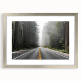 Framed wall art featuring a serene landscape design with winding roads, set in a sleek silver frame with a mat, perfect for modern home decor.