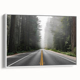 Framed canvas wall art showcasing a scenic landscape with winding roads and vibrant colors, set against a white backdrop for modern decor appeal.