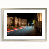 Framed wall art collection showcasing a serene landscape with winding roads, featuring a silver mat and frame that enhances the artwork's elegance.