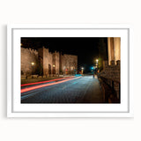 Framed wall art showcasing a scenic landscape with winding roads, presented in a sleek white mat and frame, ideal for modern home decor.