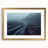 Framed wall art print showcasing a serene landscape with winding roads, featuring a gold mat and elegant frame, perfect for home decor enhancement.