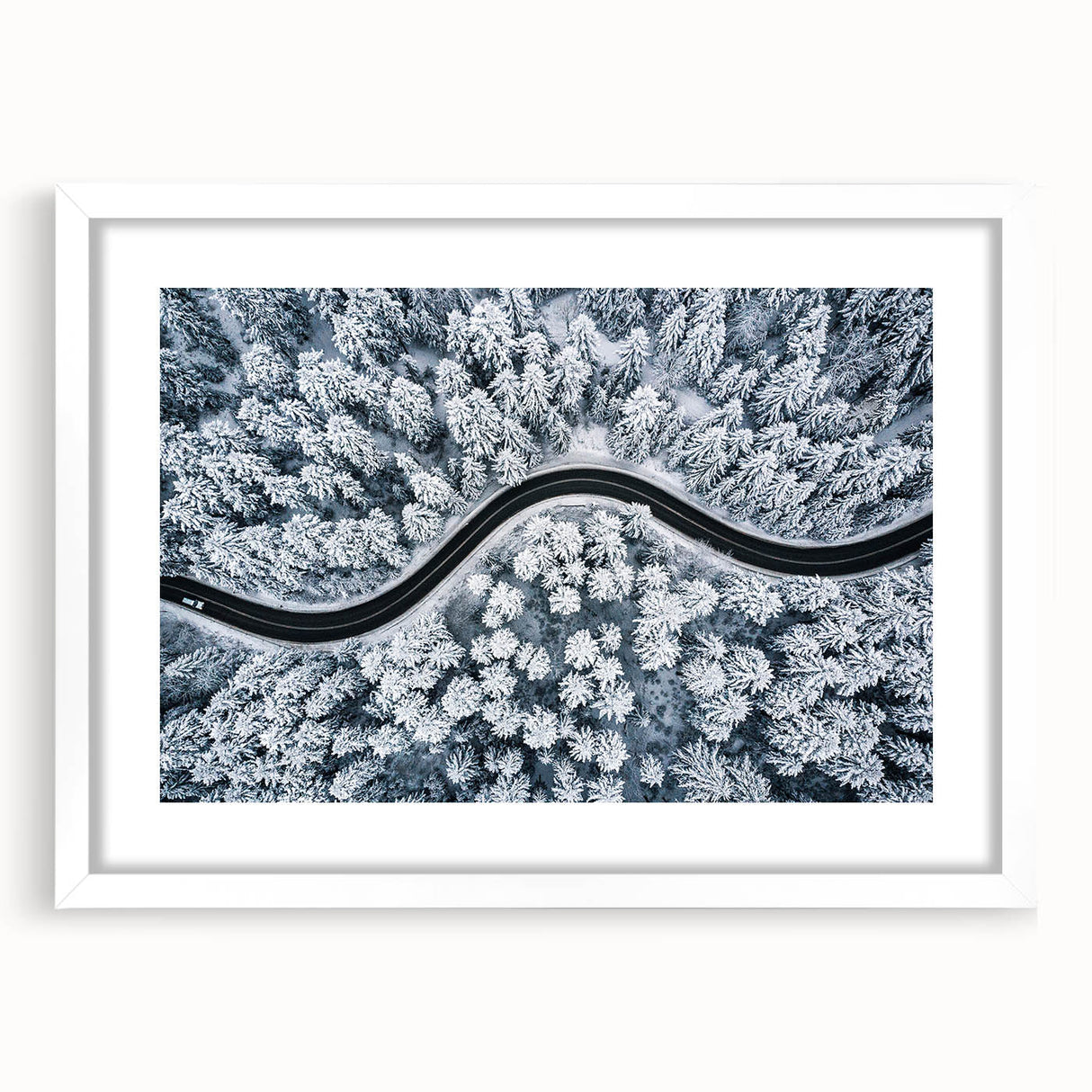 Framed landscape wall art featuring a serene road scene, displayed in a white mat frame, perfect for home decor to enhance living spaces with nature's beauty.