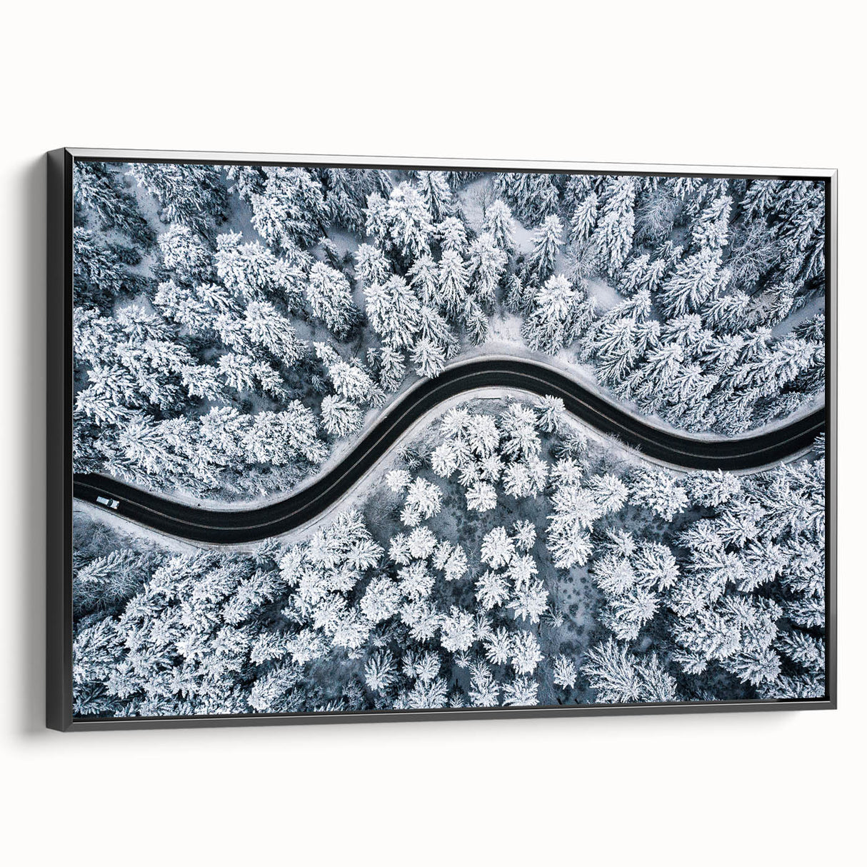 Framed canvas wall art showcasing a scenic landscape with winding roads, featuring vibrant colors and a modern black frame, perfect for enhancing home decor.