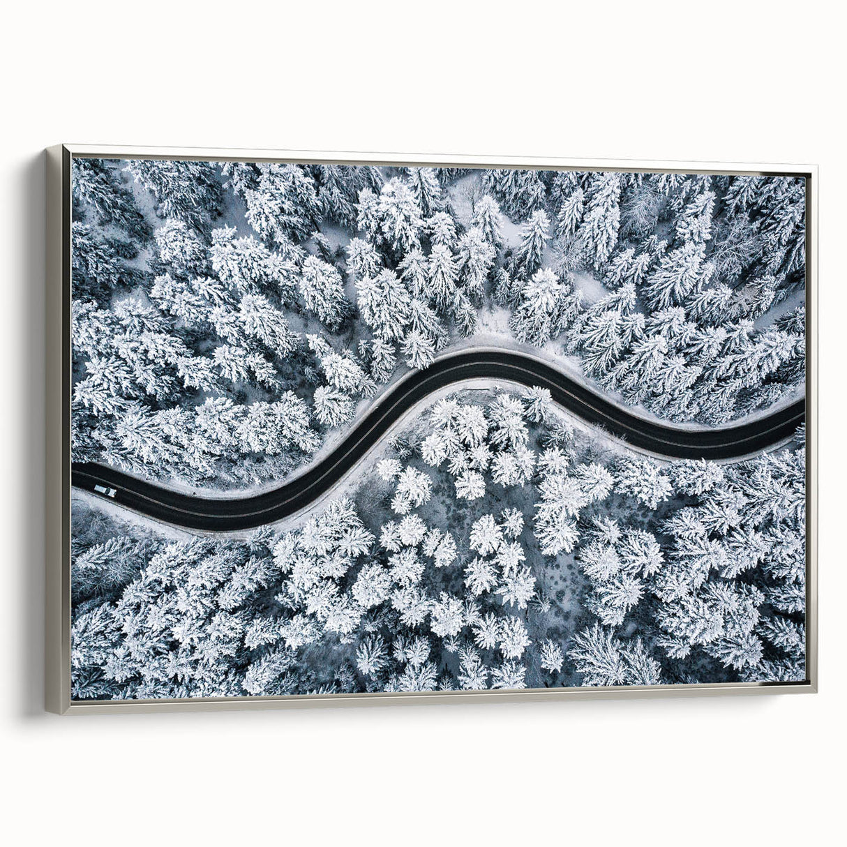 Framed canvas wall art showcasing a scenic landscape with winding roads, designed in a modern aesthetic with a sleek silver frame, perfect for contemporary decor.