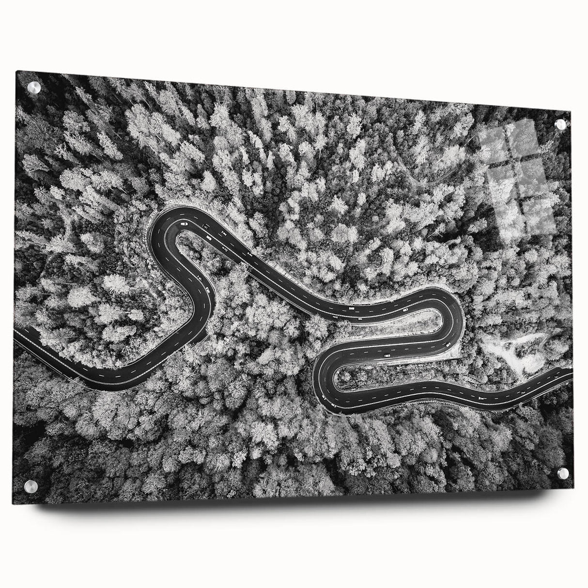 Acrylic glass wall art featuring a vibrant landscape design with winding roads and lush greenery, displayed in a side view with decorative pins, perfect for home decor.