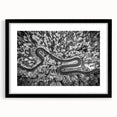 Framed landscape wall art showcasing a serene road scene, featuring a black frame and mat. Ideal for home decor, this piece enhances any living space with its calming aesthetic. Perfect for art enthusiasts seeking tranquility in their interior design.