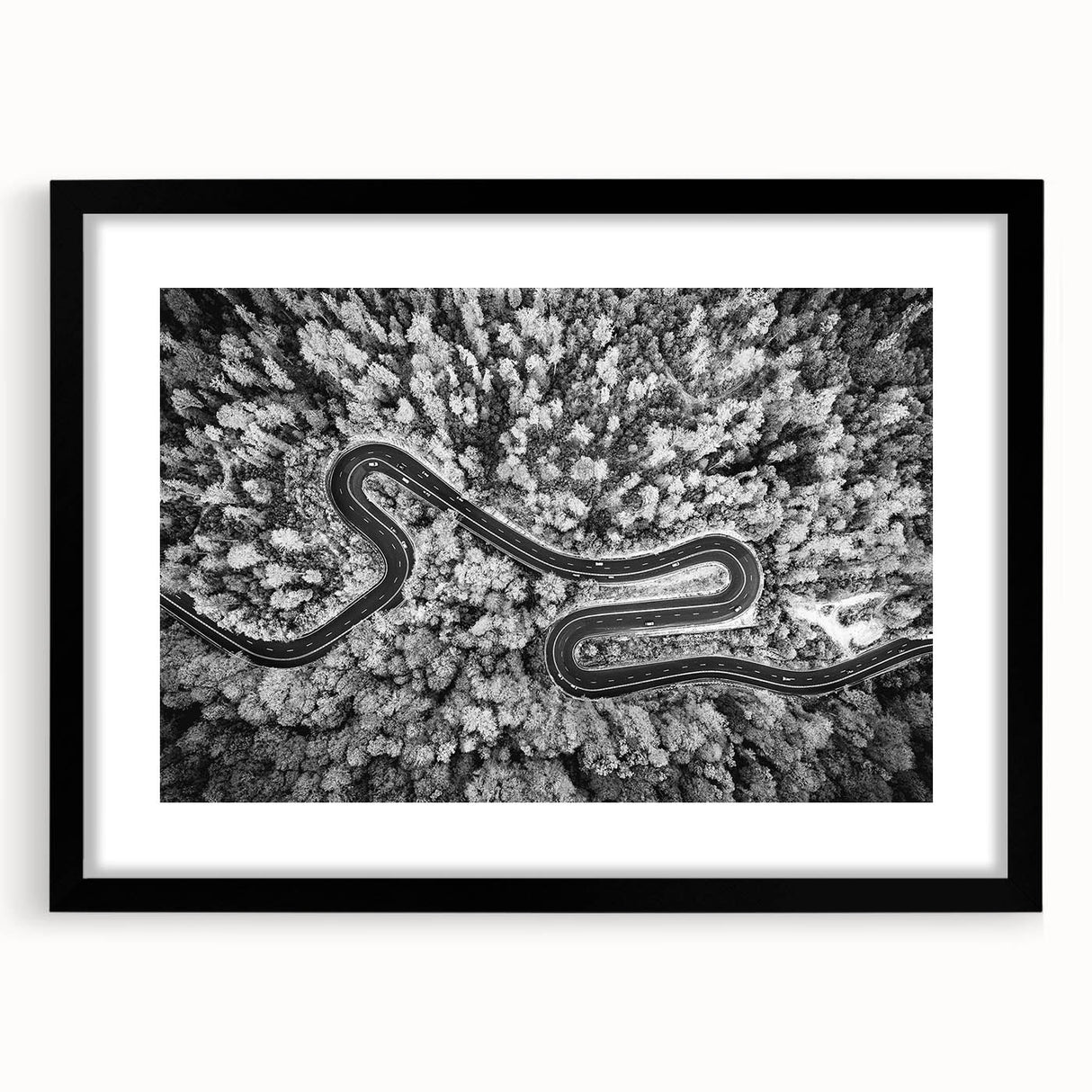 Framed landscape wall art showcasing a serene road scene, featuring a black frame and mat. Ideal for home decor, this piece enhances any living space with its calming aesthetic. Perfect for art enthusiasts seeking tranquility in their interior design.