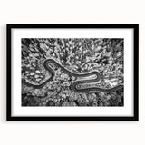 Framed landscape wall art showcasing a serene road scene, featuring a black frame and mat. Ideal for home decor, this piece enhances any living space with its calming aesthetic. Perfect for art enthusiasts seeking tranquility in their interior design.