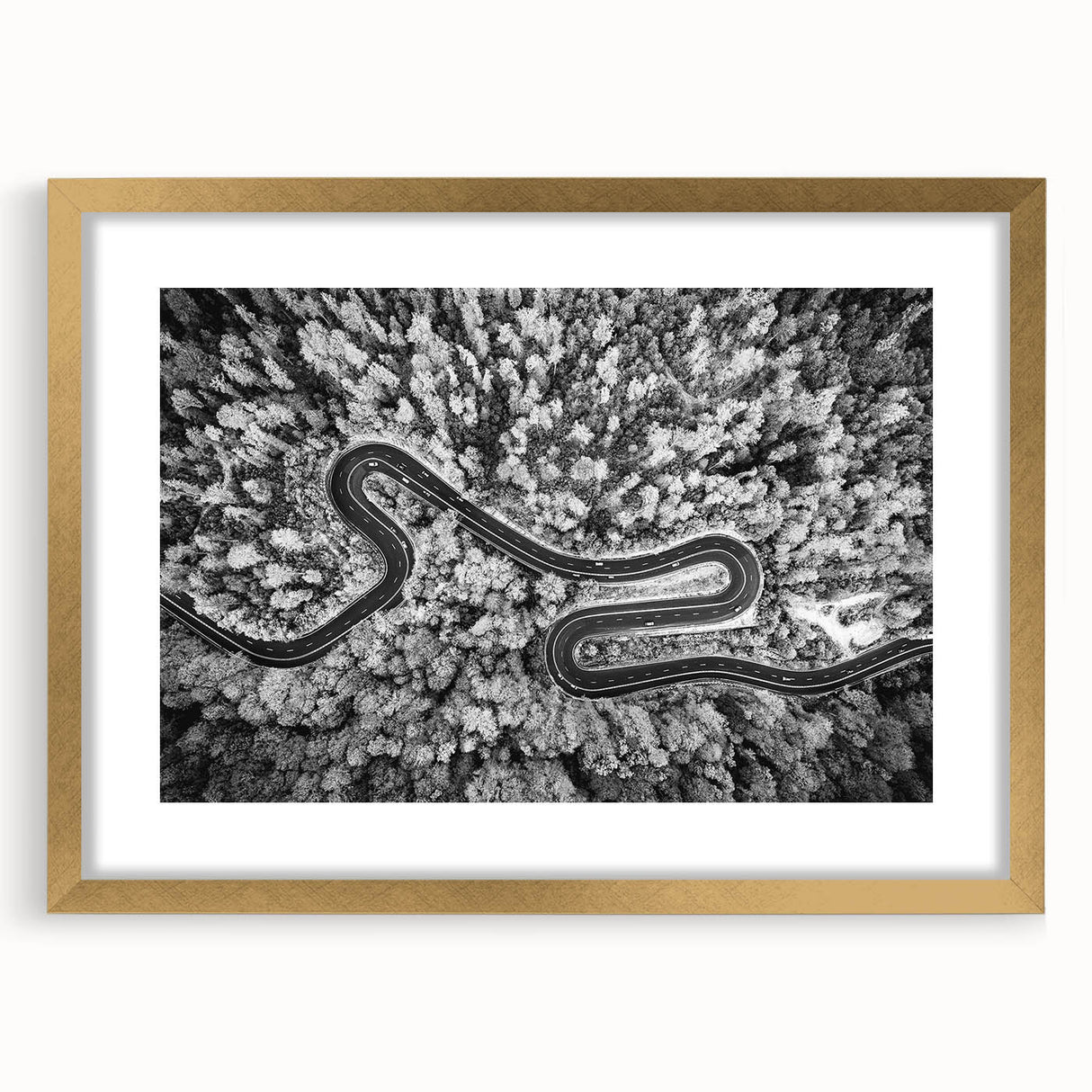 Framed wall art featuring a scenic road landscape design in gold, elegantly matted, showcasing a modern aesthetic perfect for home decor enhancement.