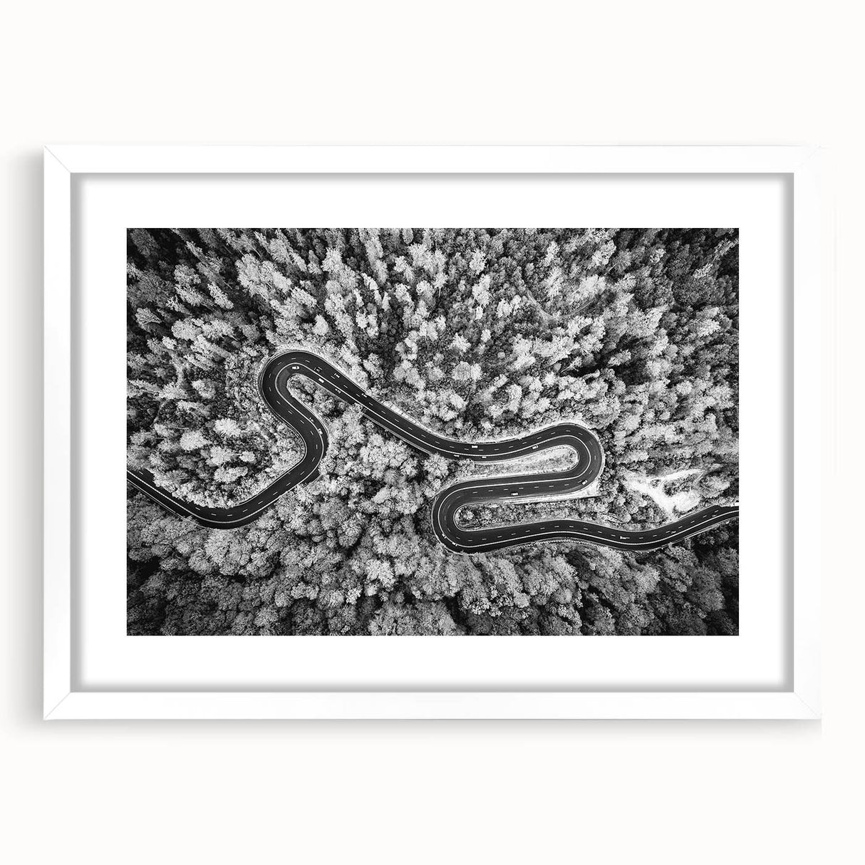 Framed landscape wall art featuring a serene road design with vibrant colors, enclosed in a sleek white mat, ideal for home decor enhancement.